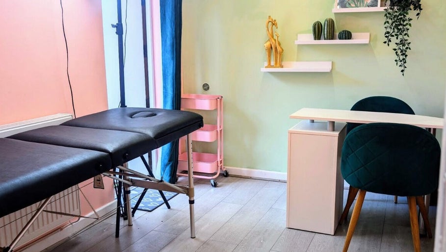 Calming treatment room at Shedz_Beauty, Stoke-on-Trent, England, GB, featuring a massage table and stylish decor.