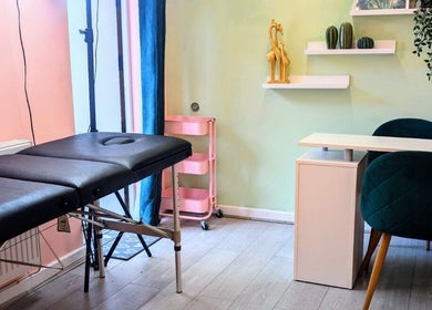 Calming treatment room at Shedz_Beauty, Stoke-on-Trent, England, GB, featuring a massage table and stylish decor.