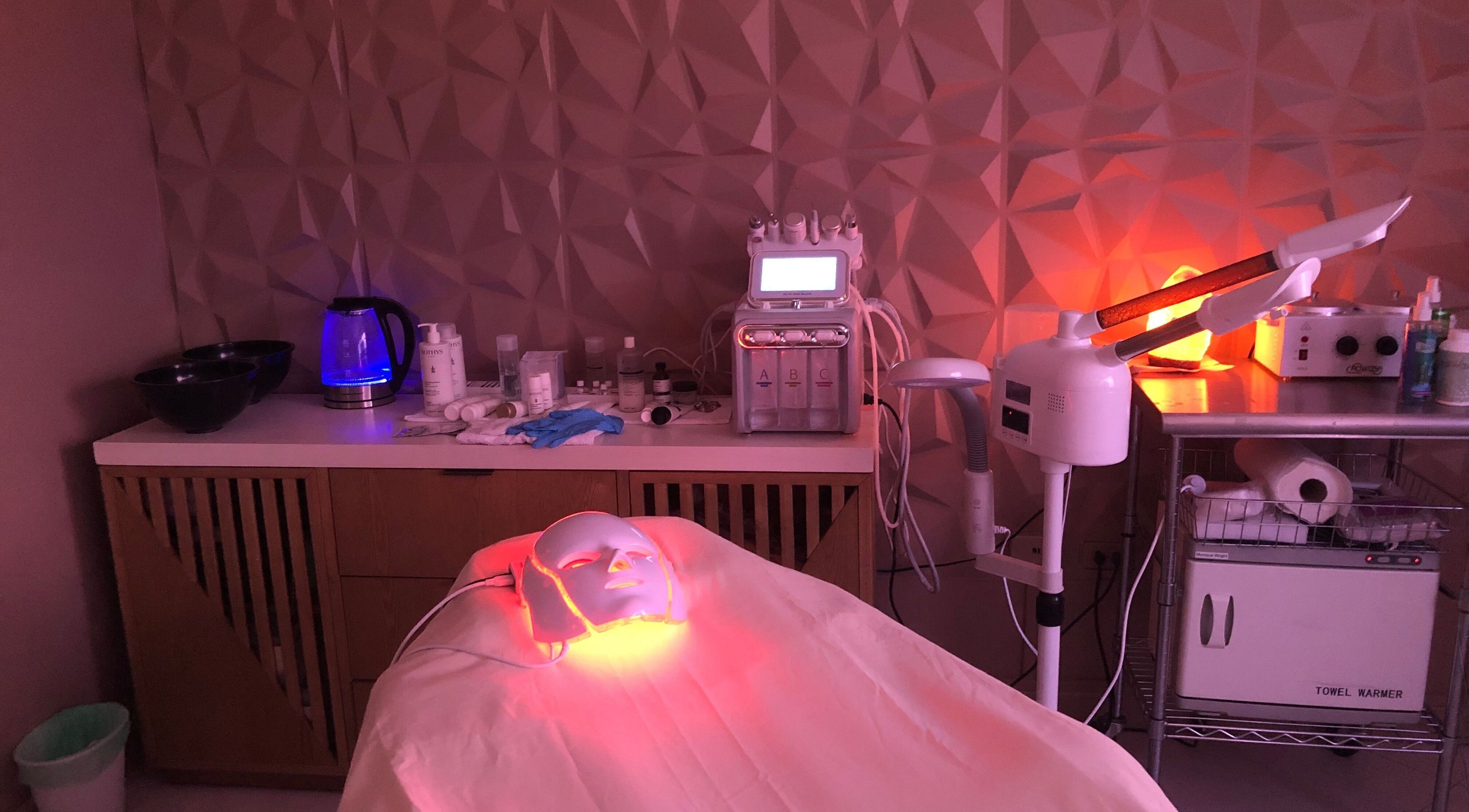 LED facial treatment setup at Luna Aesthetics, Kingston 10, St. Andrew Parish, JM in a serene, modern room.
