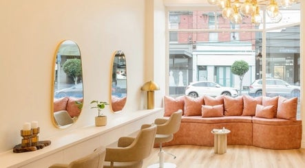 Stylish interior of Rose Rituals, Melbourne, Victoria, AU, with cozy seating and modern decor.