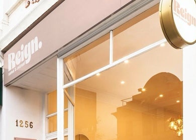 Rose Rituals entrance in Melbourne, Victoria, AU with elegant signage and modern glass facade.