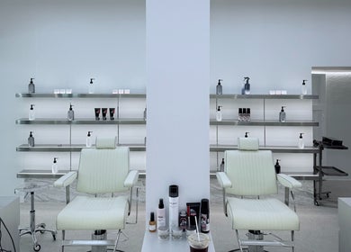 Interior view of Twenty.Two Cut & Facial Premium Barbershop in Krung Thep Maha Nakhon, TH, featuring sleek decor.