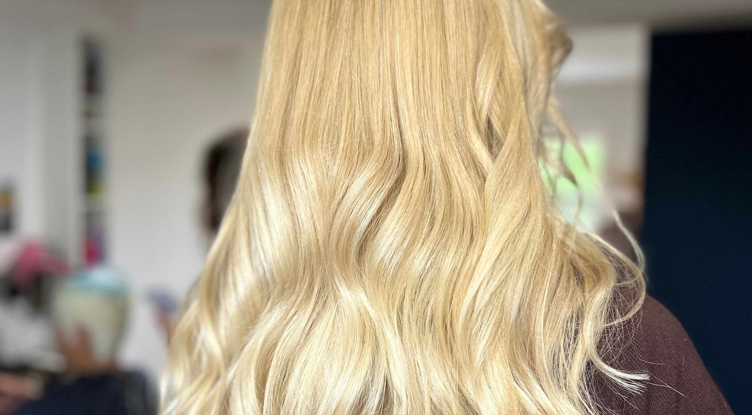 Blonde hair styled perfectly at Courtney Louise hair, Spalding, England, GB. Shiny and smooth locks showcased.