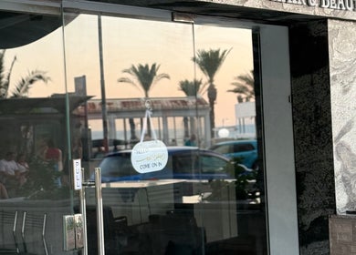 Entrance of Anastasia Rallo Hair & Beauty in San Pawl Il-baħar, MT with glass door and welcoming sign.