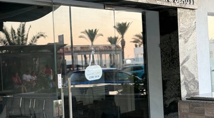 Entrance of Anastasia Rallo Hair & Beauty in San Pawl Il-baħar, MT with glass door and welcoming sign.