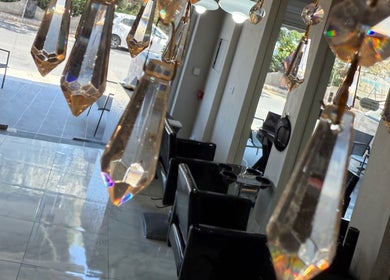 Elegant crystal chandelier at Anastasia Rallo Hair & Beauty, San Pawl Il-baħar, MT showcases luxury interior.