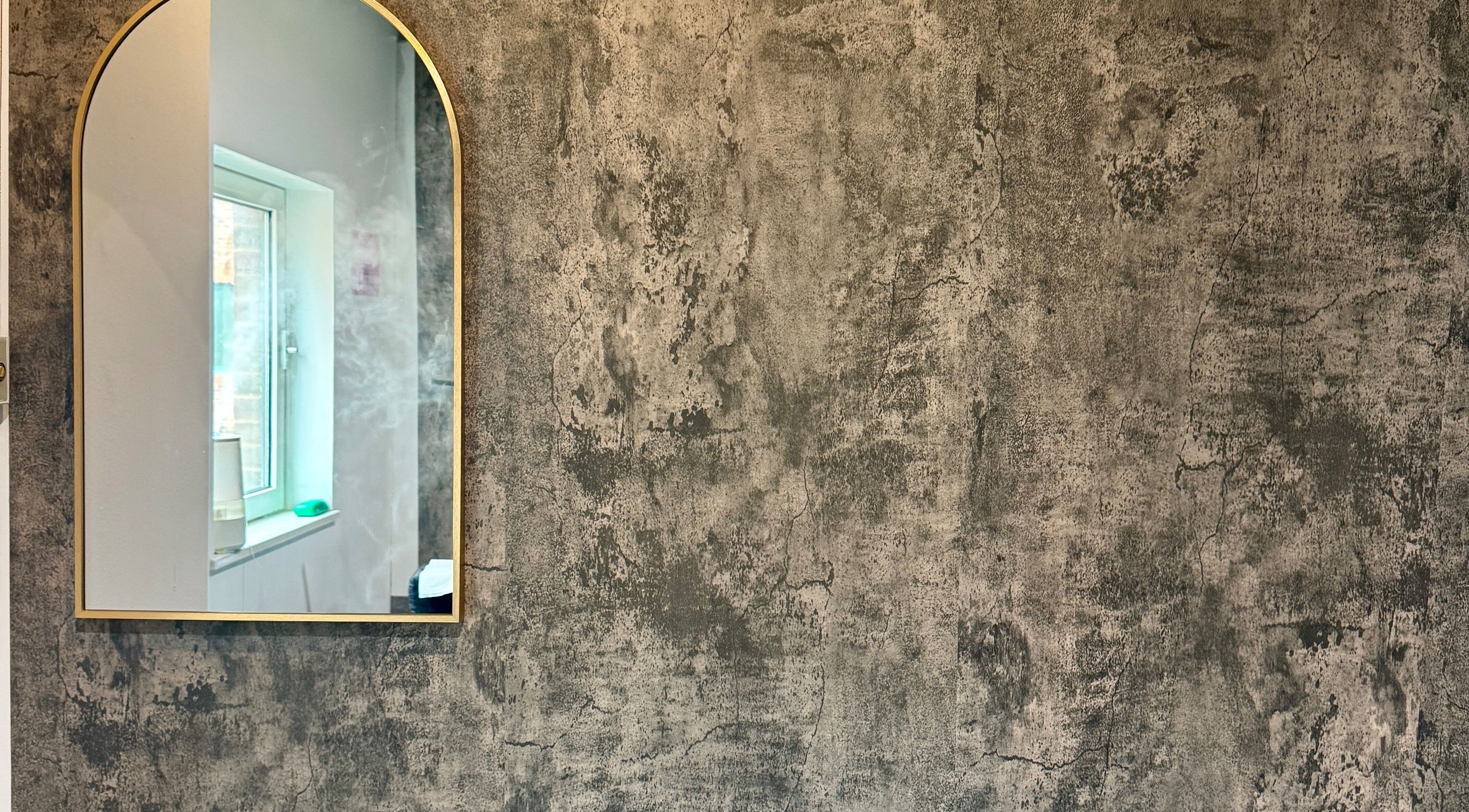 Elegant mirror at The Blink Atelier LDN, London, England, GB reflecting natural light.