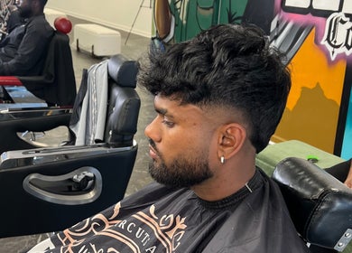 Client with trendy haircut at MG TRIMZ, Leeds, England, GB, showcasing modern barbering style.