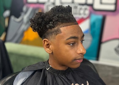 Young man with a stylish haircut at MG TRIMZ, Leeds, England, GB barbershop.
