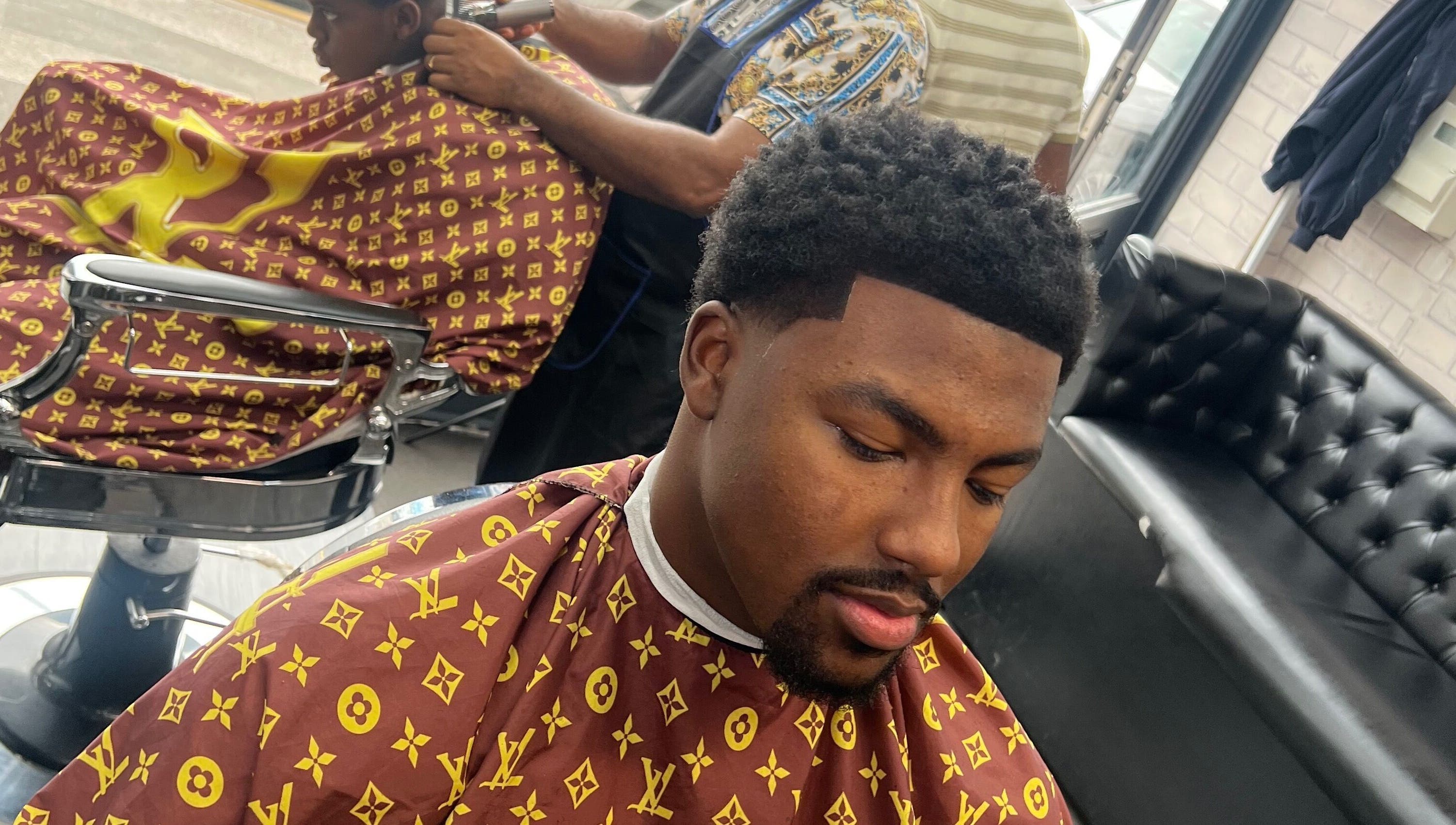 Client receives stylish haircut at MG TRIMZ in Leeds, England, GB.