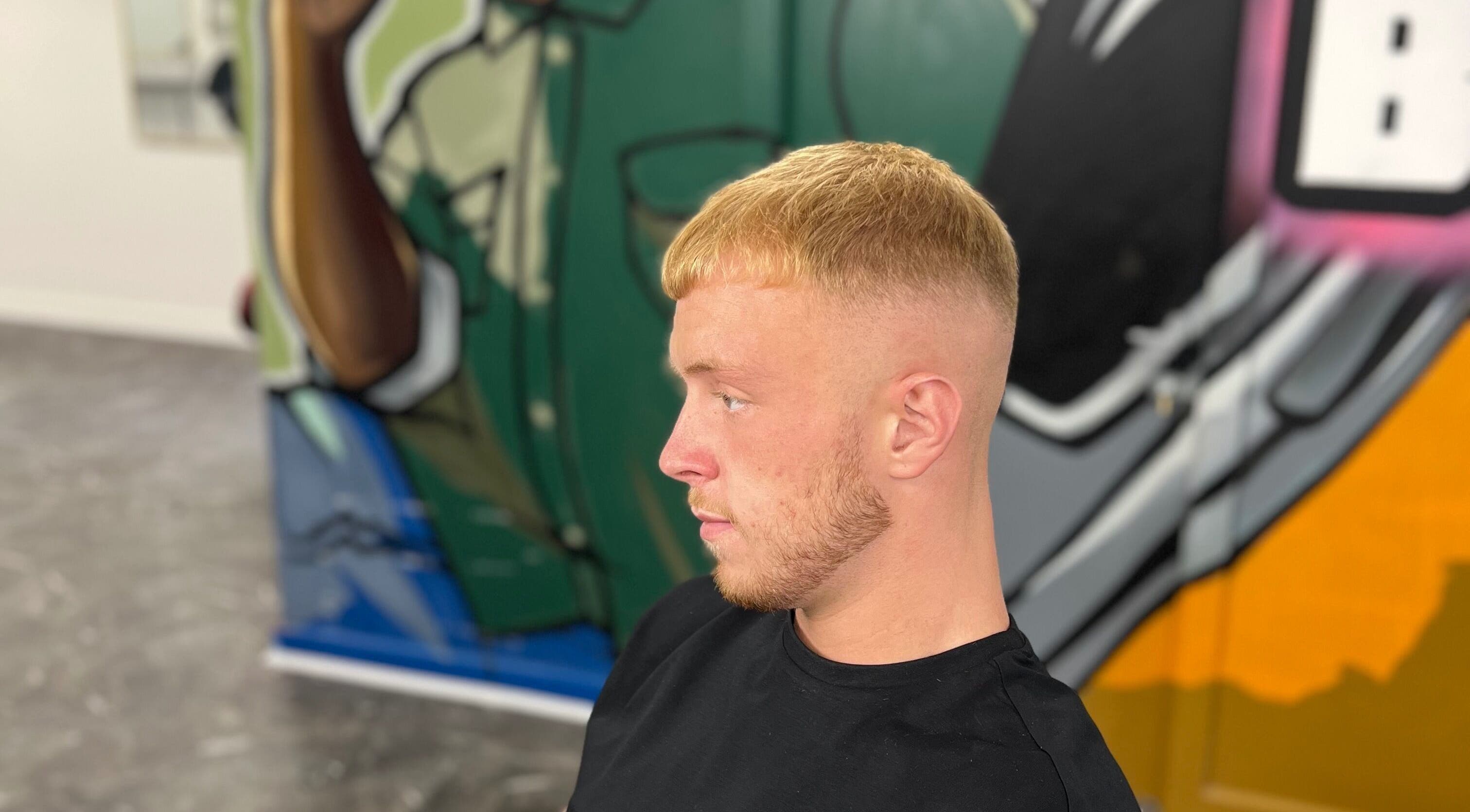 Client with stylish fade haircut at MG TRIMZ in Leeds, England, GB showcasing modern barber skills.