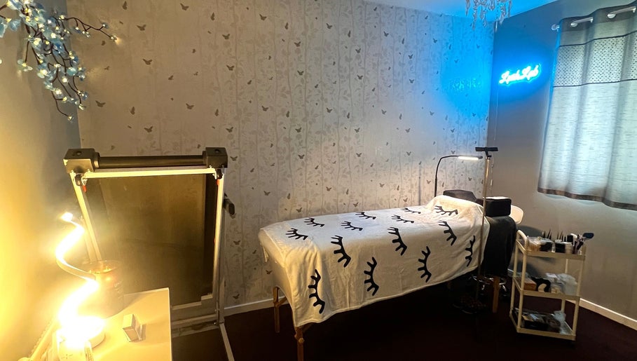 Tranquil treatment room at Lush Lab, Burnley, England, GB, featuring a cozy bed and calming decor.