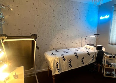 Tranquil treatment room at Lush Lab, Burnley, England, GB, featuring a cozy bed and calming decor.
