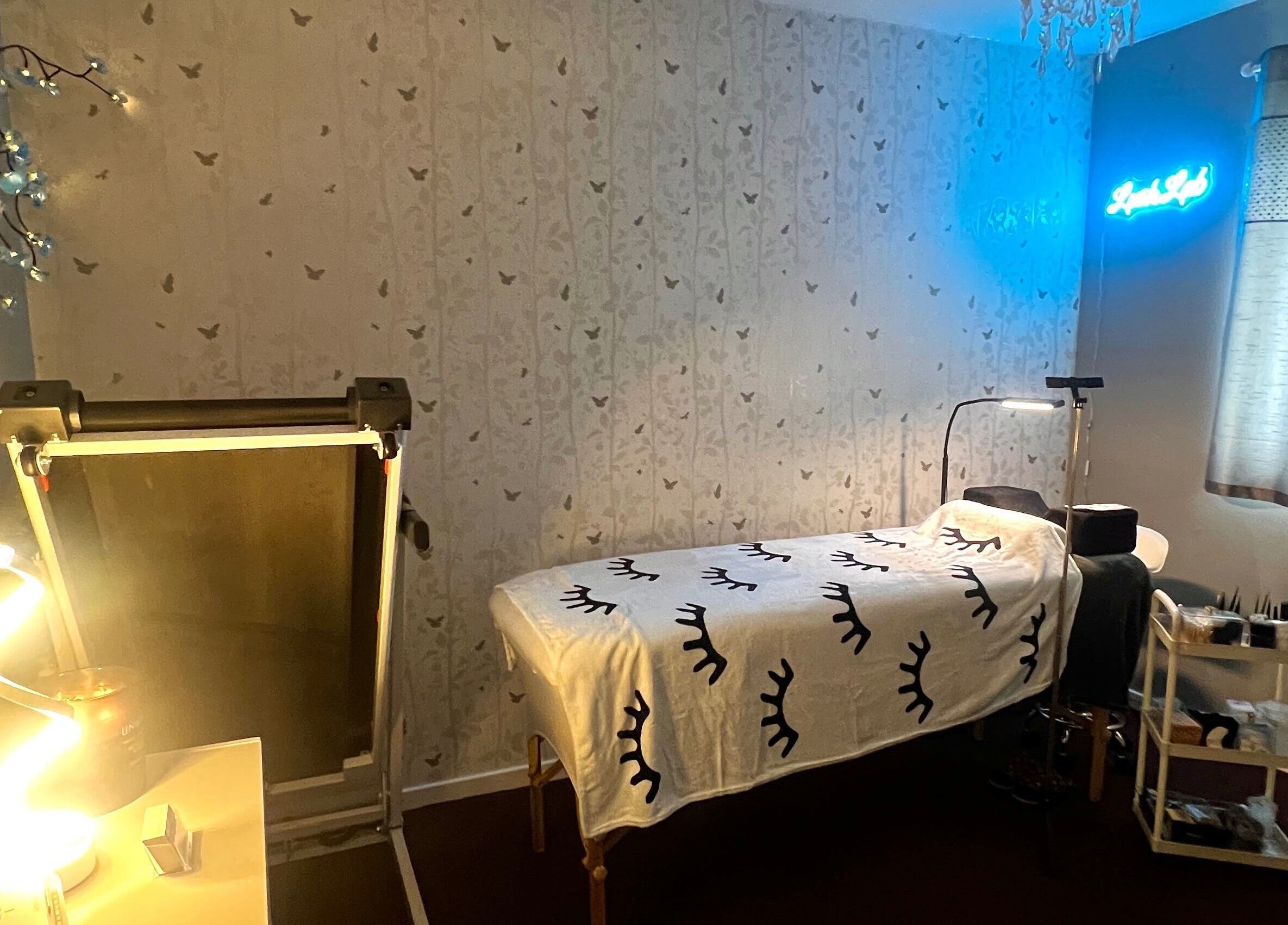 Tranquil treatment room at Lush Lab, Burnley, England, GB, featuring a cozy bed and calming decor.