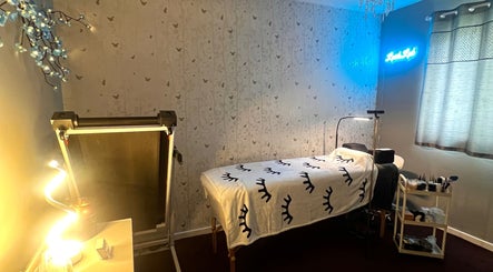 Tranquil treatment room at Lush Lab, Burnley, England, GB, featuring a cozy bed and calming decor.