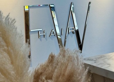 Stylish FW Hair sign at Jasmin Eden Hair, Newport, Shropshire, GB, reflecting modern elegance.