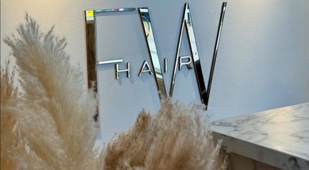 Stylish FW Hair sign at Jasmin Eden Hair, Newport, Shropshire, GB, reflecting modern elegance.