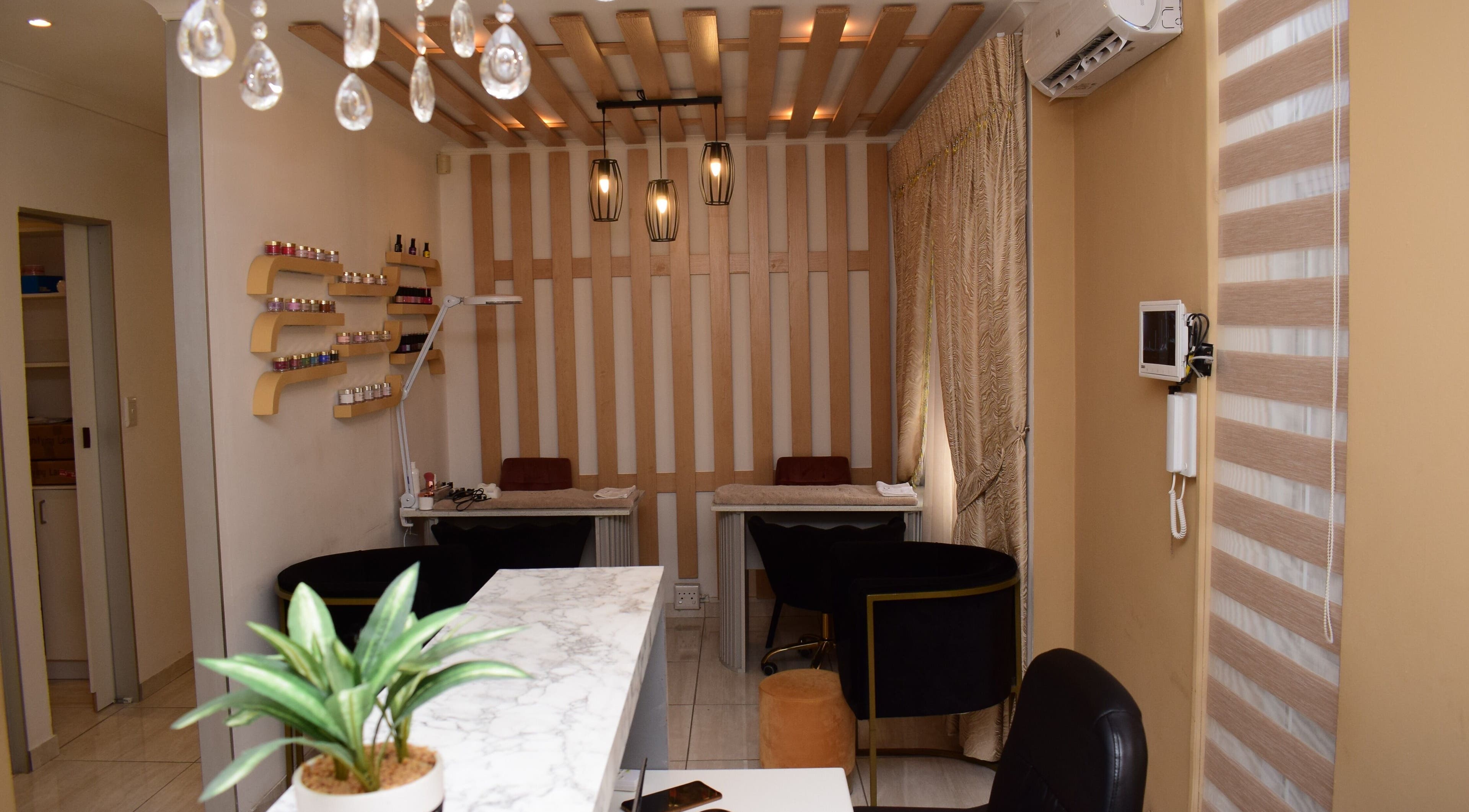 Éarthé Wellness Skincare and Spa's serene treatment area in Randburg, Gauteng, ZA with elegant decor and lighting.