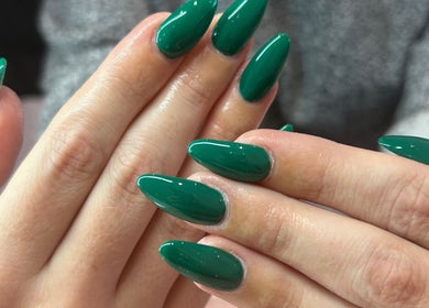 Elegant emerald green gel nails at Jade Billings Hair & Beauty, Chelmsford, England, GB.