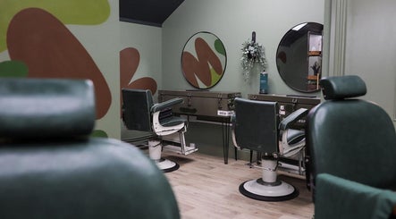 Modern barber chairs at Lishman Barbers, Newcastle upon Tyne, England, GB. Stylish decor and grooming tools.