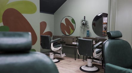 Elegant interior of Lishmans Barbershop in Newcastle upon Tyne, England, GB with stylish barber chairs.