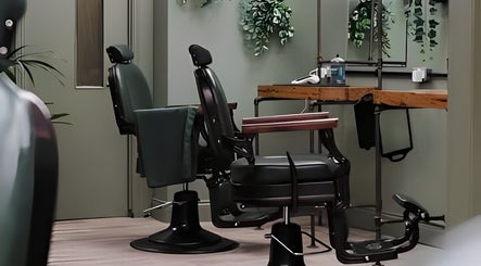Interior of Lishmans Barbershop in Newcastle upon Tyne, England, GB featuring stylish chairs and elegant decor.