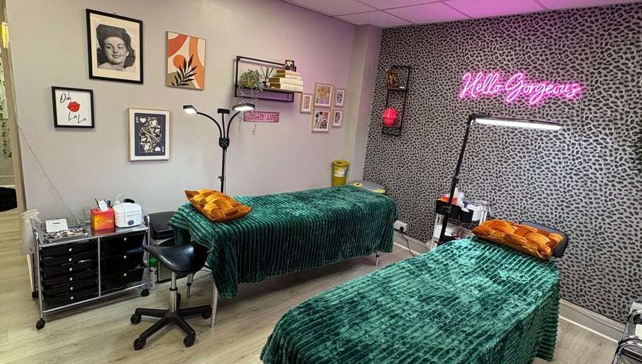 Beauty treatment room at Very Bettie, Horley, England, GB with vibrant decor and neon sign.