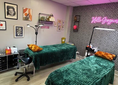 Beauty treatment room at Very Bettie, Horley, England, GB with vibrant decor and neon sign.
