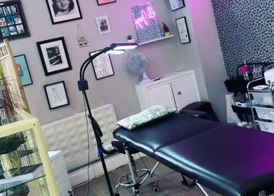 Cozy treatment room at Very Bettie, Horley, England, GB with modern decor and comfortable massage table.