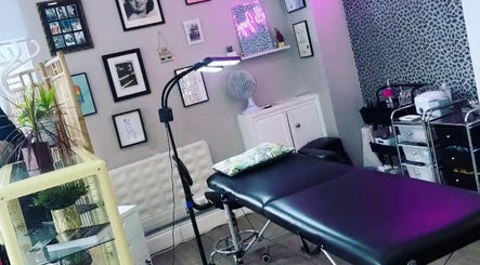 Cozy treatment room at Very Bettie, Horley, England, GB with modern decor and comfortable massage table.