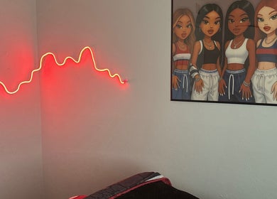 Room at SIERRA VISTA📍with red neon light and vibrant artwork, Sierra Vista, Arizona, US.