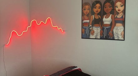 Room at SIERRA VISTA📍with red neon light and vibrant artwork, Sierra Vista, Arizona, US.