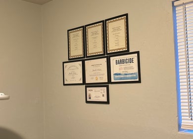 Certificates and licenses on wall at Bratzified Beauty, Douglas, Arizona, US showcase expertise.