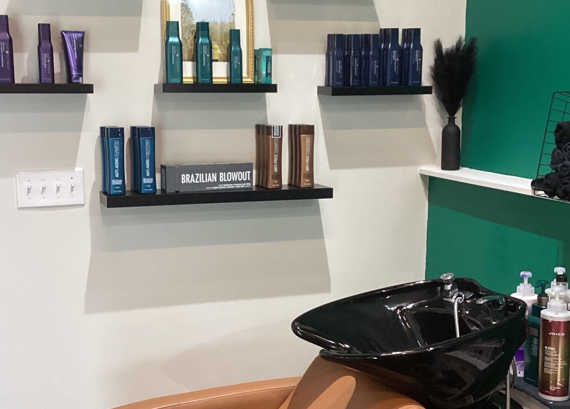 Wash station and branded products at Styles By Kelly in Ruston, Louisiana, US.