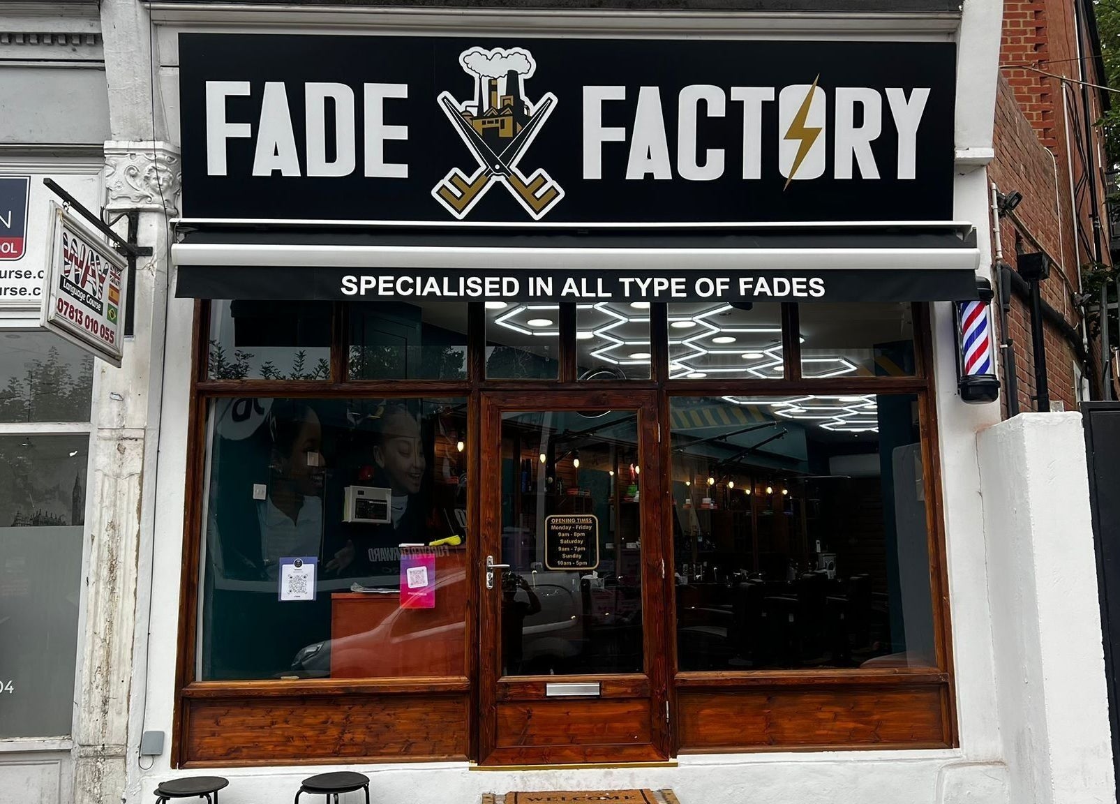 Front of Fade Factory - Balham, a trendy barbershop in London, England, GB, specializing in modern fades.