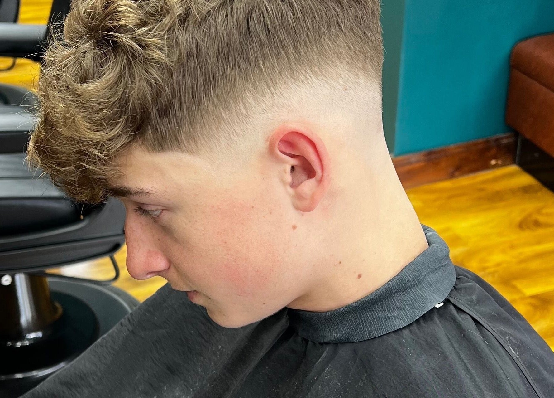 Sharp fade hairstyle at Fade Factory - Balham, London, England, GB, highlighting expert barber craftsmanship.