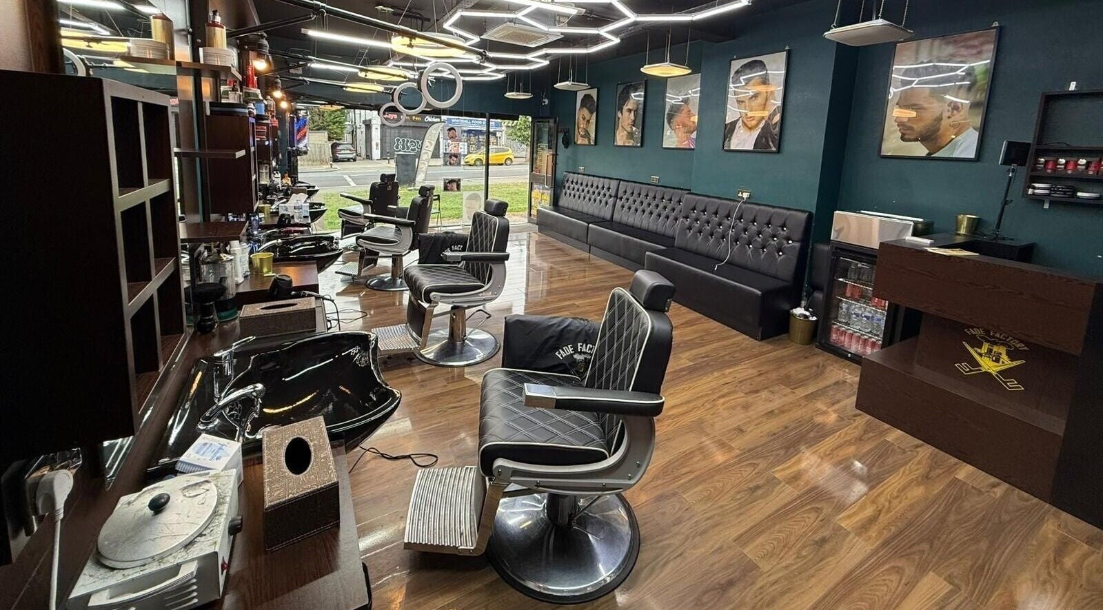 Modern barber chairs and chic interior at Fade Factory, Morden, England, GB.