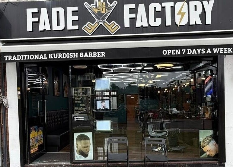 Exterior of Fade Factory, a traditional Kurdish barber in Morden, England, GB, open 7 days a week.
