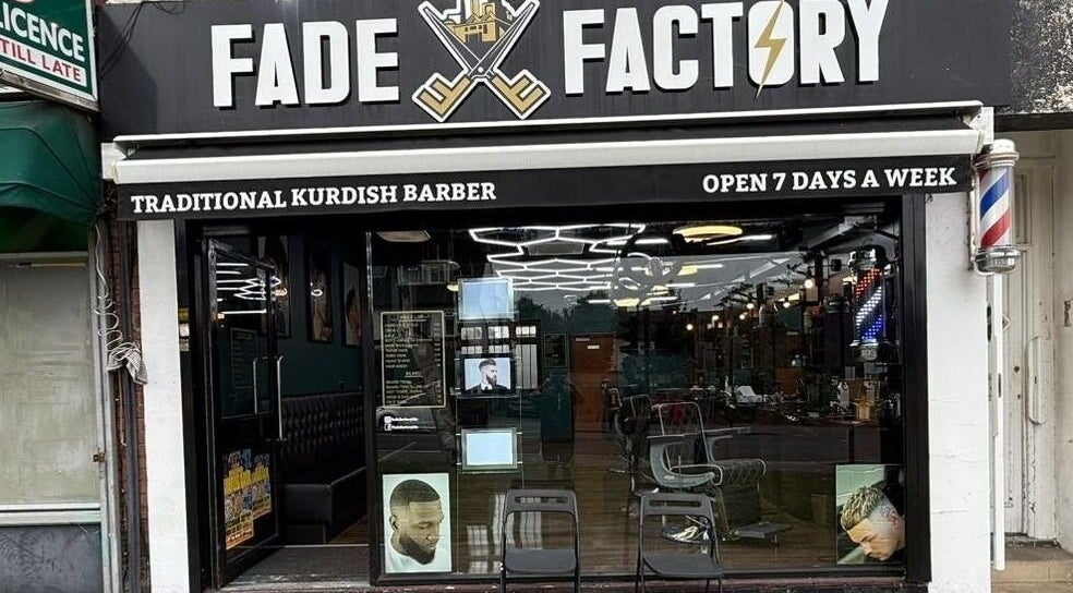 Exterior of Fade Factory, a traditional Kurdish barber in Morden, England, GB, open 7 days a week.