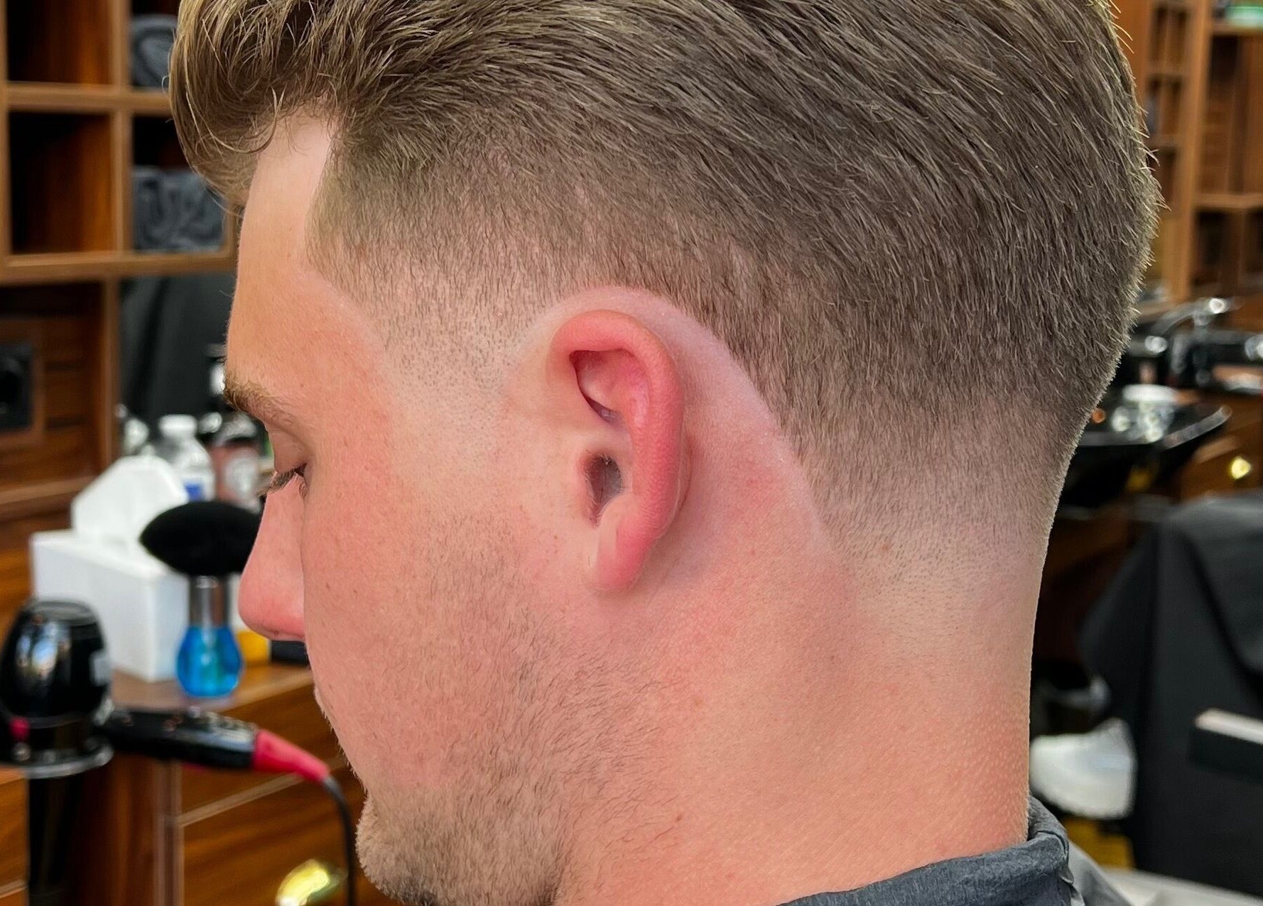Close-up of a sharp fade haircut at Fade Factory, Morden, England, GB showcasing barbering expertise.