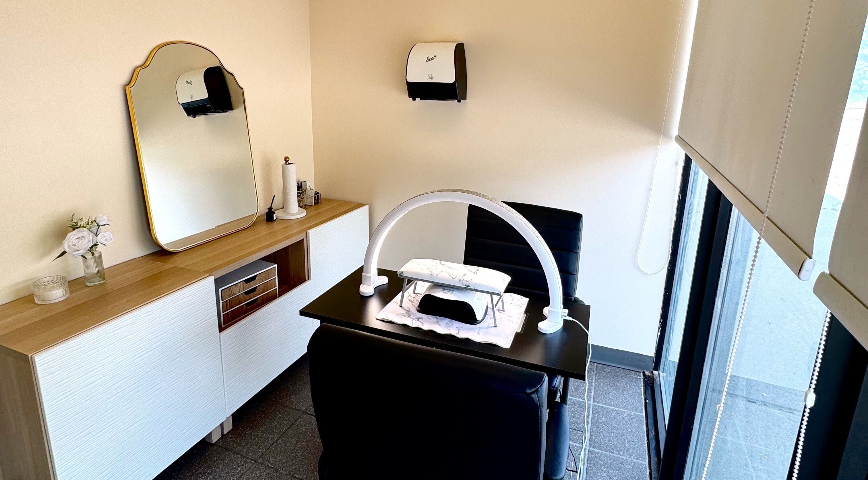Elegant nail workstation at Beauty By Naz in Oshawa, Ontario, CA, with modern decor and lighting.