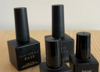 Collection of black nail polish bottles at ShoshanaStudios, Montréal, Québec, CA.