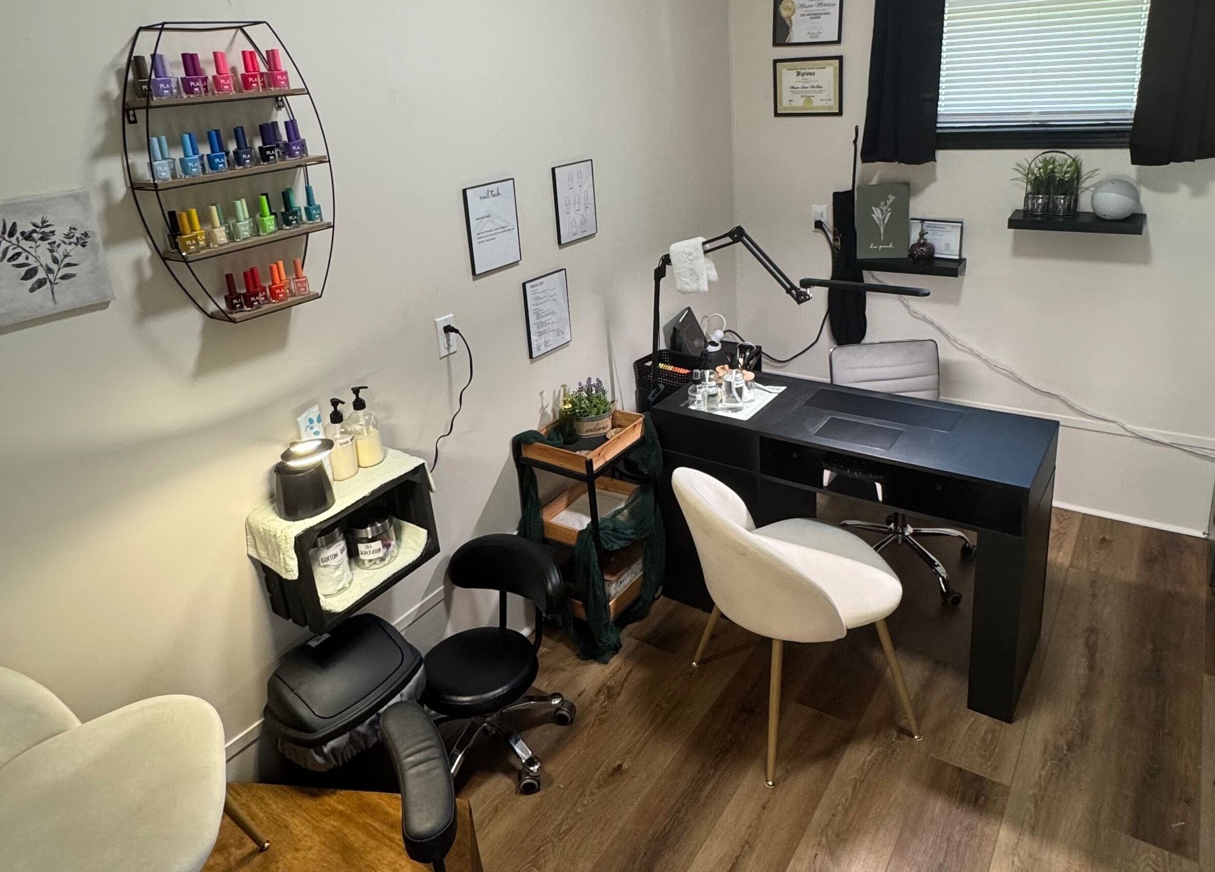 Elegant nail studio at NailsByMaycee, Estill Springs, Tennessee, US, featuring a stylish workspace and colorful polish display.