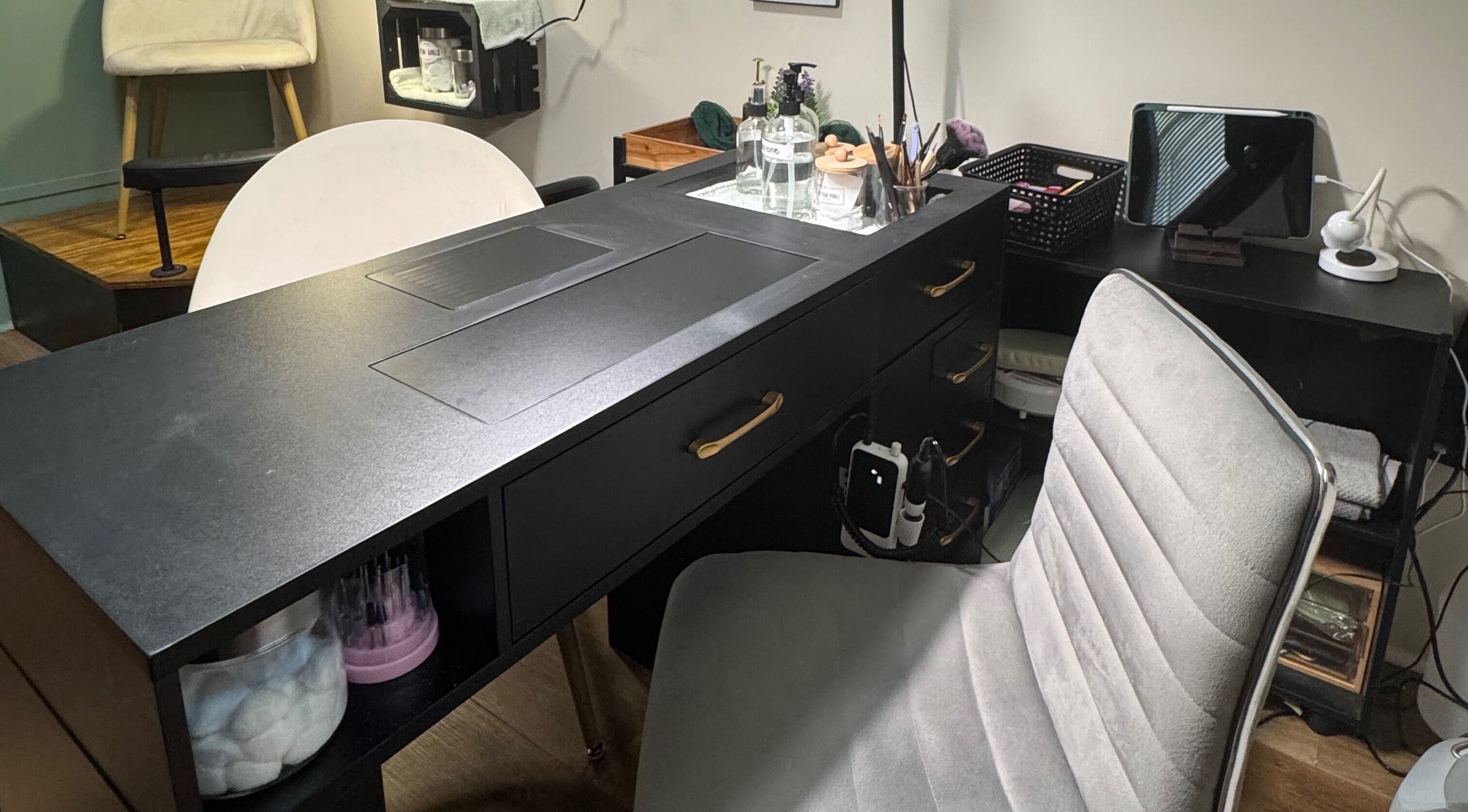 NailsByMaycee salon desk setup in Estill Springs, Tennessee, US, featuring a stylish chair and manicure tools.