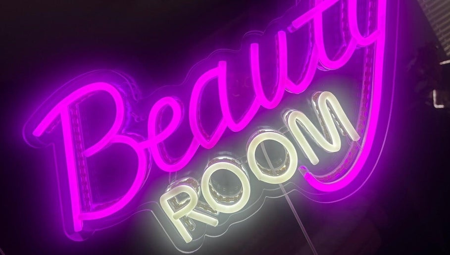 Vibrant neon 'Beauty Room' sign at Blosm Beauty, Cumbernauld, Scotland, GB.