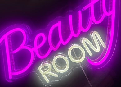 Vibrant neon 'Beauty Room' sign at Blosm Beauty, Cumbernauld, Scotland, GB.