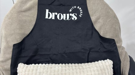 Cozy black apron on a soft chair at Brows With Breeze, Rufford Avenue, England, GB inviting relaxation.