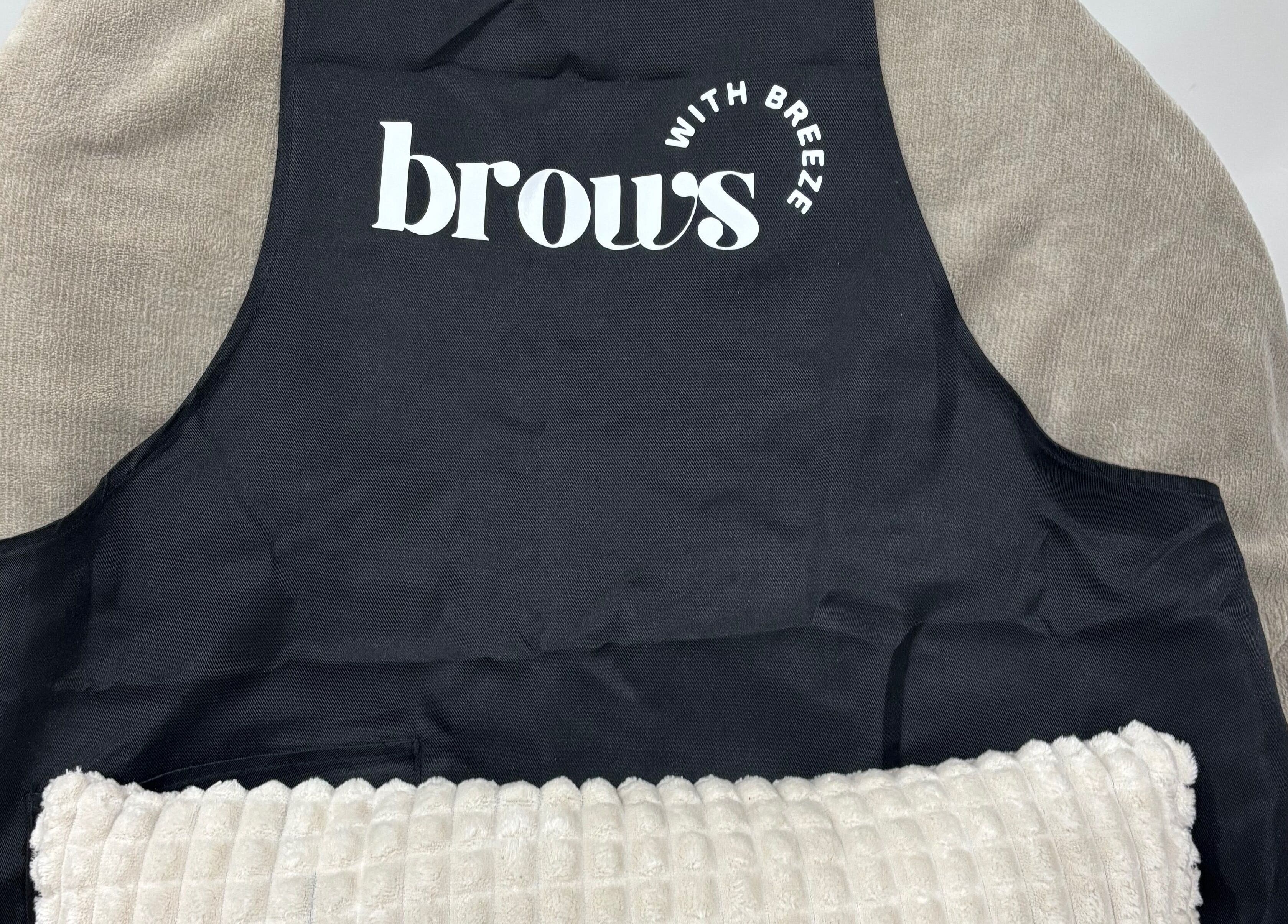 Comfortable treatment chair at Brows With Breeze, Rainworth, England, GB with branded cover.