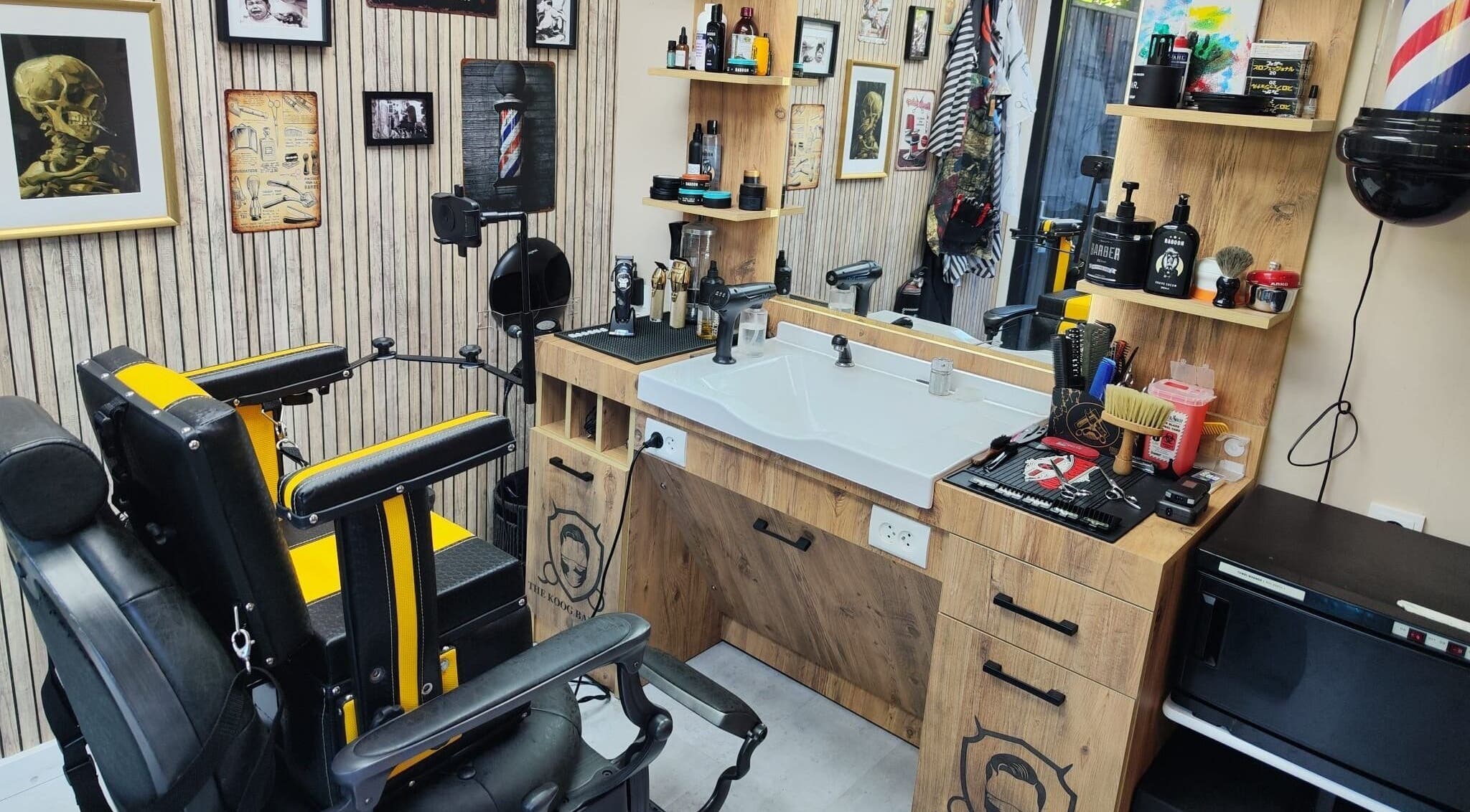 Interior of The Koog Barber in Koog Aan De Zaan, Noord-holland, NL featuring stylish chairs and grooming tools.