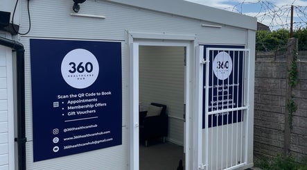 Entrance of 360 Healthcare Hub in Wigan, England, GB shown with promotional signage.